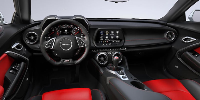 Dashboard of Chevrolet Camaro with black red seats