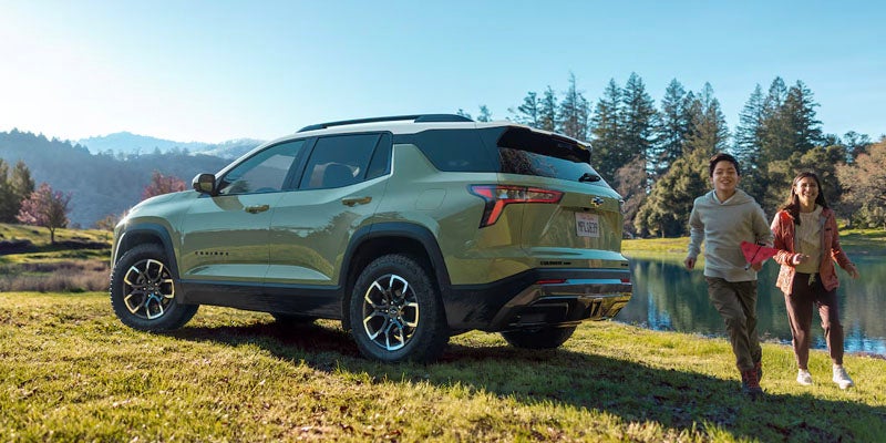 A boy and girl enjoying picnic near river and green equinox